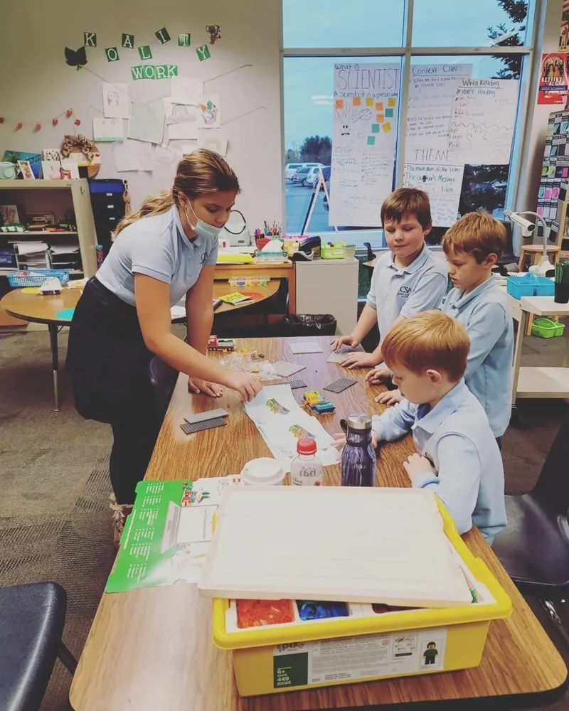 Eliana working with students in a classroom